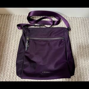 Tumi Voyageur Canton Nylon Crossbody in Mulberry.